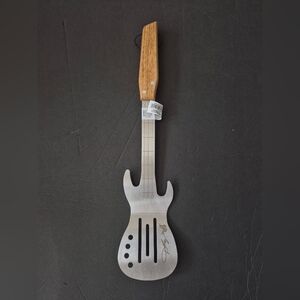 Dolly Parton Guitar-Shaped Spatula  Brand new. Never used before.